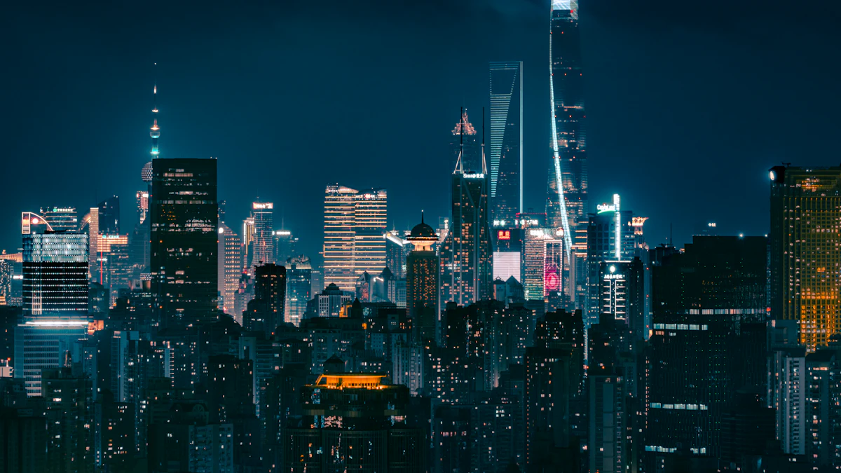 Skyscrapers lit up at night across a large city skyline