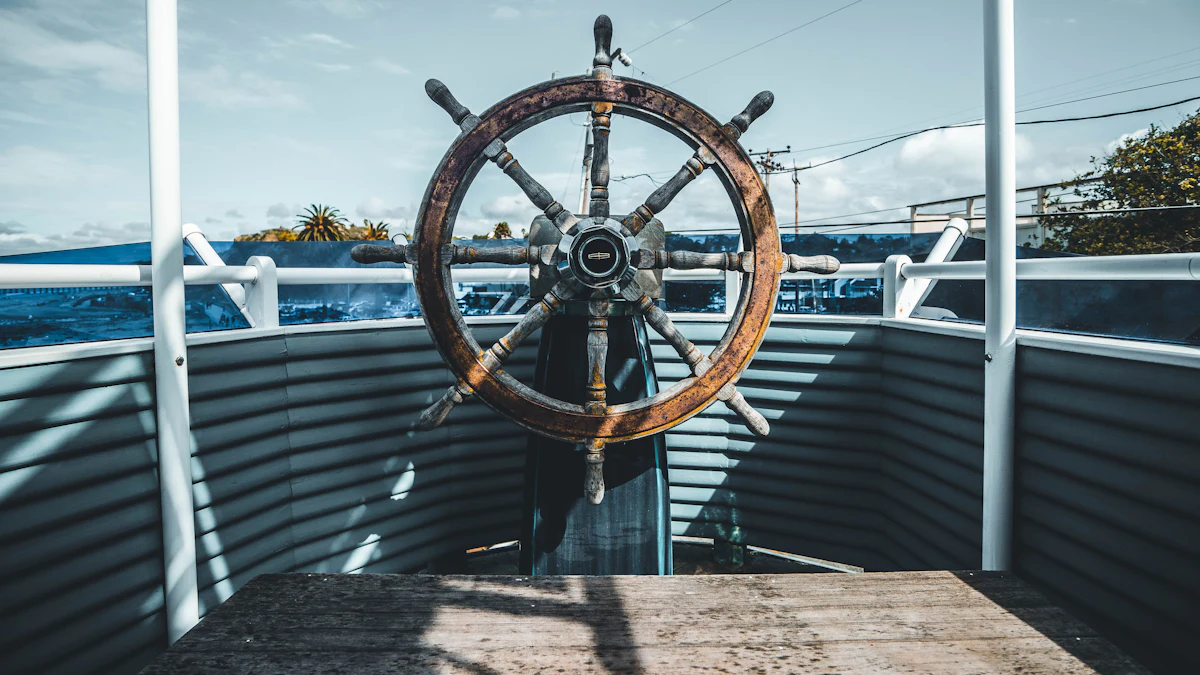 A ship’s wooden steering wheel on a deck under a bright sky